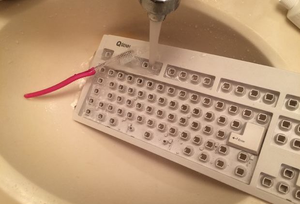 How to clean the keyboard with a brush